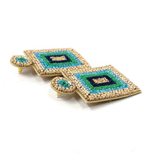 Load image into Gallery viewer, Bold geometric earrings showcasing layered turquoise and green bead embroidery framed with metallic gold beads.