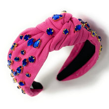 Load image into Gallery viewer, Chic fashion look showcasing a gemstone embellished headband and dramatic blue crystal earrings in natural sunlight