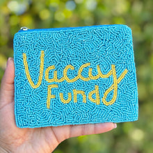 Load image into Gallery viewer, Light blue hand-beaded pouch with yellow “Vacay Fund” lettering and zip closure.