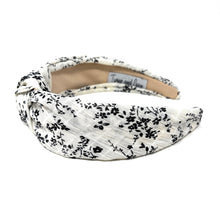 Load image into Gallery viewer, Stylish floral twist headband in black and ivory with a comfortable wide-band design.