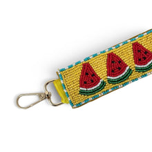Load image into Gallery viewer, Hand beaded watermelon wristlet keychain featuring three colorful watermelon slices on a mustard yellow beaded strap with turquoise trim. Includes a gold-tone lobster clasp and soft wrist loop, perfect for carrying keys, key fobs, ID badges, or small accessories.