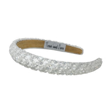 Load image into Gallery viewer, White headband with a label on a white background