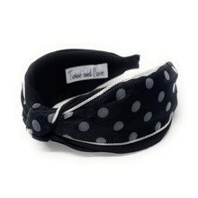 Load image into Gallery viewer, Black headband with white polka dots on a white background