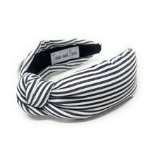 Load image into Gallery viewer, Black and white striped headband with a knot on a white background