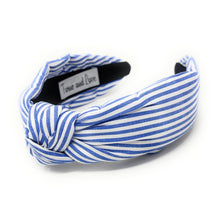 Load image into Gallery viewer, Blue and white striped headband with a knotted detail in the center, set against a plain white background, conveying a trendy, nautical style.