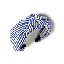 Load image into Gallery viewer, Blue and white striped headband with a knotted detail in the center, set against a plain white background, conveying a trendy, nautical style.