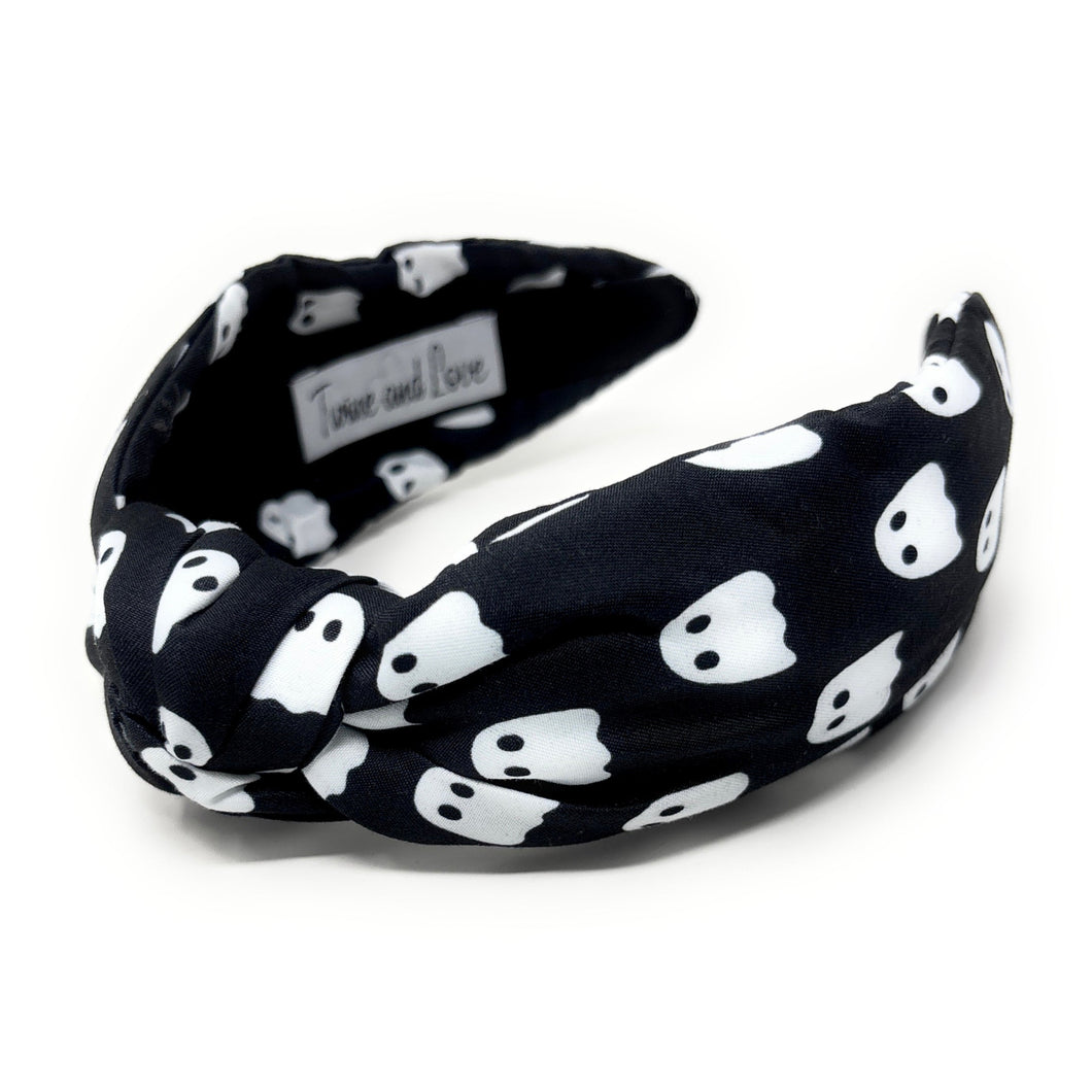 Five Halloween-themed headbands with different patterns: spider webs on black, candy corn, plaid, jack-o'-lanterns on orange, and ghosts on black.
