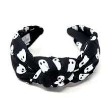 Load image into Gallery viewer, Black headband with white ghost pattern on a white background