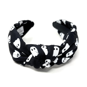 Black headband with white ghost pattern on a white background