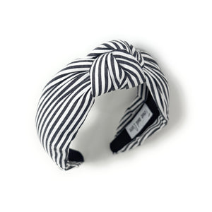 Black and white striped headband on a white background