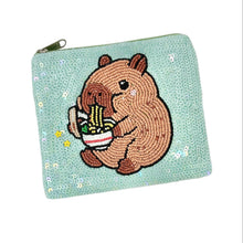 Load image into Gallery viewer, Adorable zipper pouch with a capybara graphic and colorful sequins.