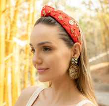 Load image into Gallery viewer, Stylish basketball earrings worn by a woman in a bamboo forest