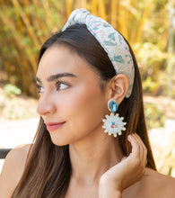 Load image into Gallery viewer, Model showcasing statement earrings with a stylish headband