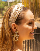 Load image into Gallery viewer, A woman featuring a stylish headband adorned with jewels and matching earrings in an outdoor environment.