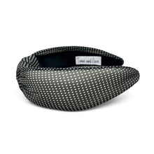 Load image into Gallery viewer, A wide fabric headband with a black and white polka dot pattern, shown on a plain white background. A small interior label reads 'Twine and Love'.