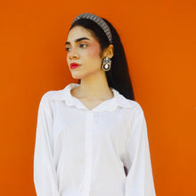 Load image into Gallery viewer, Chic earrings complementing a casual outfit of a model.