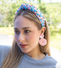 Load image into Gallery viewer, A beautiful woman displaying a chic style with a floral headband and pink earrings, perfect for summer fashion.