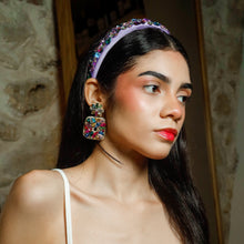 Load image into Gallery viewer, Close-up of vibrant multicolor earrings worn by a fashion model.