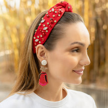 Load image into Gallery viewer, close-up of a woman wearing a stylish red headband adorned with jewels and eye-catching beaded earrings