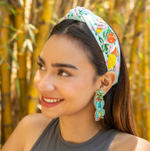 Load image into Gallery viewer, Model wearing a colorful fruit-themed headband and earrings
