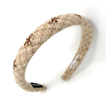 Load image into Gallery viewer, Cozy wool headbands in earthy tones, ideal for winter fashion.