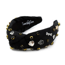 Load image into Gallery viewer, A fashionable black headband adorned with decorative charms and beads.