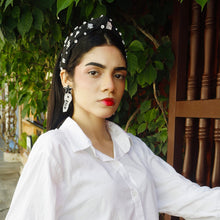 Load image into Gallery viewer, Close-up of a woman showcasing elegant accessories, including earrings and a headband.
