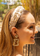 Load image into Gallery viewer, A woman featuring a stylish headband adorned with jewels and matching earrings in an outdoor environment.