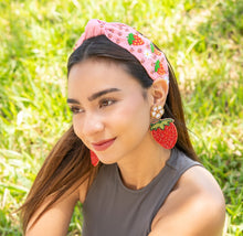 Load image into Gallery viewer, Chic strawberry earrings complementing a casual summer look.