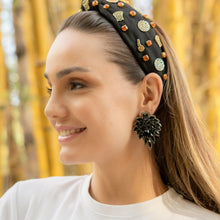 Load image into Gallery viewer, Close-up of a woman's fashion accessories including a decorative headband and earrings, set against a bamboo backdrop.
