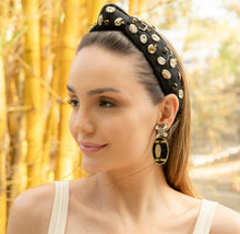 Load image into Gallery viewer, A woman showcasing elegant earrings and a jeweled headband in a bamboo background.