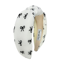 Load image into Gallery viewer, Soft fabric headband adorned with a playful bow print.