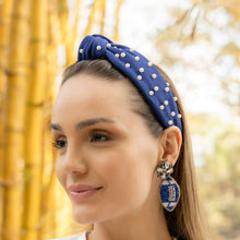 Load image into Gallery viewer, Trendy earrings and a blue headband with pearl details showcased on a model's profile.