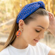 Load image into Gallery viewer, Portrait of a woman with a blue headband and colorful earrings