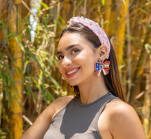 Load image into Gallery viewer, close-up of a woman wearing patriotic earrings and a stylish headband