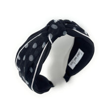 Load image into Gallery viewer, Black headband with white polka dots on a white background