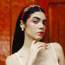 Load image into Gallery viewer, Portrait of an elegant woman with a red headband and stylish earrings.
