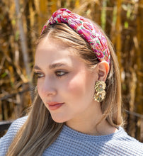 Load image into Gallery viewer, Woman wearing a floral headband and gold flower earrings in a sunny outdoor setting.