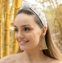 Load image into Gallery viewer, Elegant gold cheer earrings worn by a smiling woman