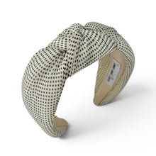Load image into Gallery viewer, Side view of ivory and black polka dot headband with a padded knotted top