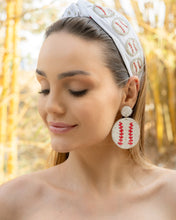 Load image into Gallery viewer, Fashionable love baseball earrings displayed against a backdrop of bamboo.