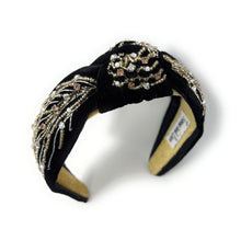 Load image into Gallery viewer, Black headband with gold embellishments on a white background