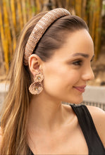 Load image into Gallery viewer, A fashionable headband showcased on a model's head.