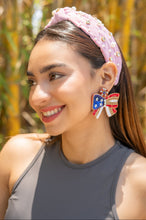 Load image into Gallery viewer, cheerful woman with a vibrant summer look featuring a headband and statement earrings