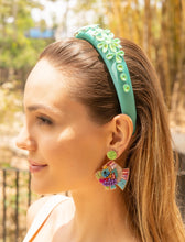 Load image into Gallery viewer, A woman displaying colorful beaded earrings paired with a green headband in a natural setting.