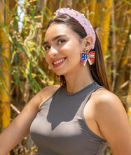 Load image into Gallery viewer, cheerful woman with a vibrant summer look featuring a headband and statement earrings