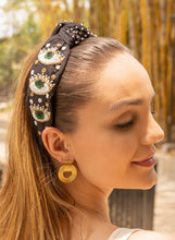 Load image into Gallery viewer, A fashionable headband featuring beaded eye designs, perfect for summer styling.