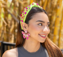 Load image into Gallery viewer, A close-up of a stylish headband adorned with jewels.