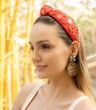 Load image into Gallery viewer, Close-up of a woman wearing a stylish Basketball red headband with golden embellishments.