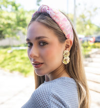 Load image into Gallery viewer, A woman in summer style, featuring a pink headband and elegant gold earrings in a natural setting.